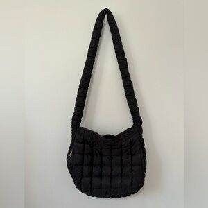 Urban Expressions Black quilted crossbody bag with gold hardware.